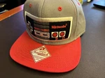 Nintendo Classic Controller Snapback Hat, Gray And Red, One Size New Tag. Fixed Price $21.99.